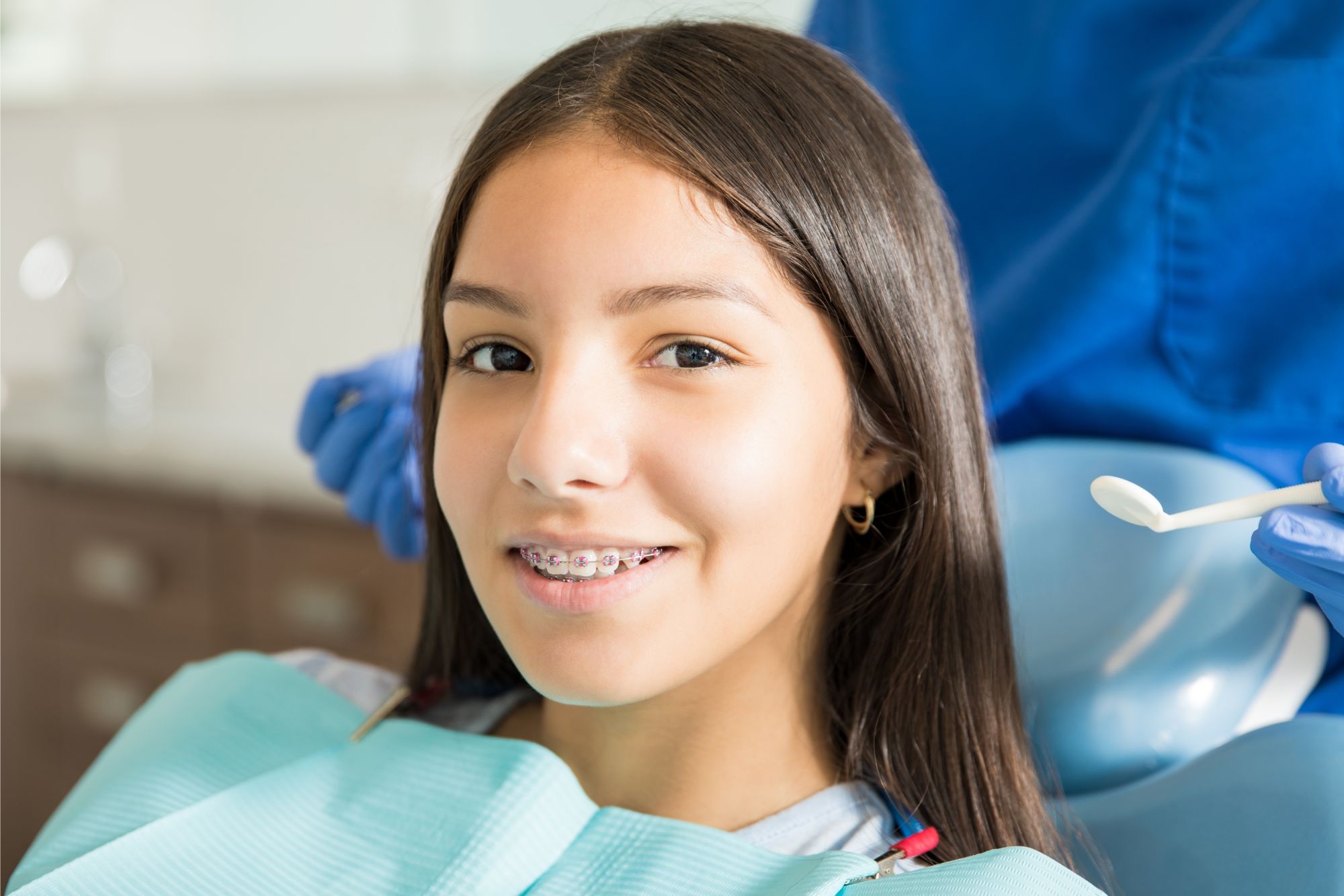 girl smiling at orthodontist free consult