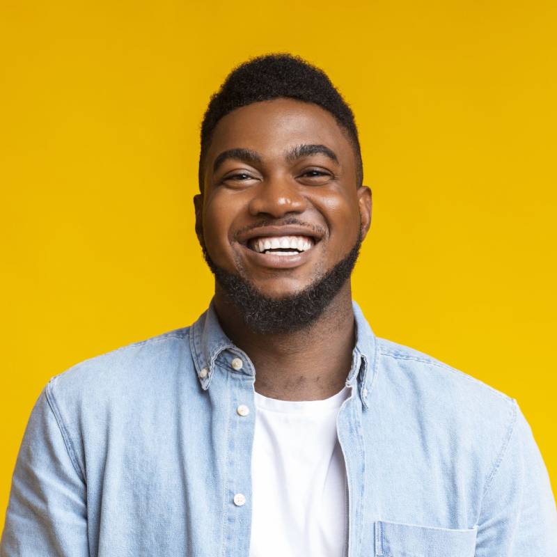 smiling patient with clear aligners